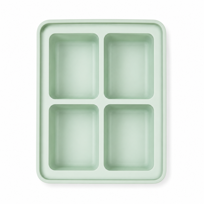 Mint green 4-compartment silicone baby food freezer tray, top view showing deep portion wells